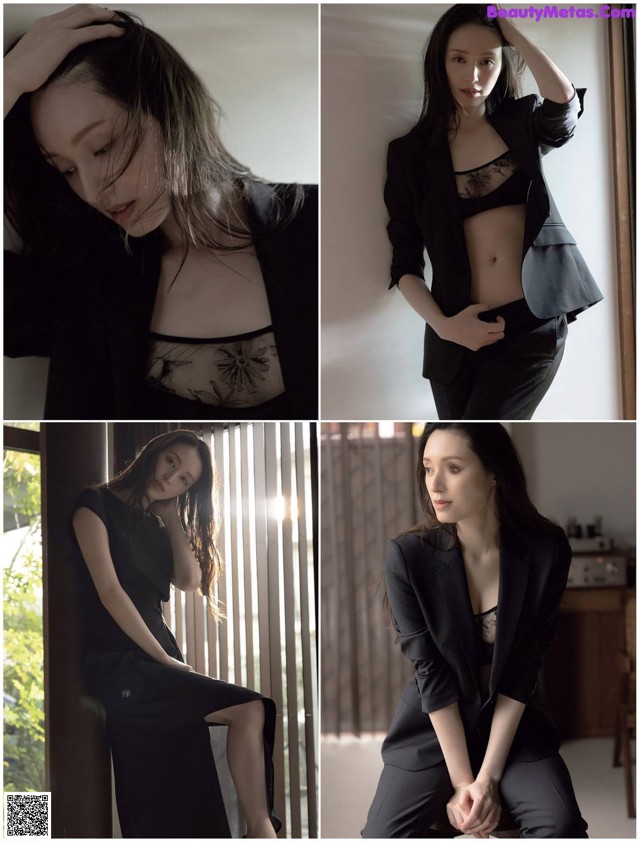 A woman in a black suit posing for a picture.