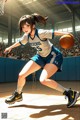 A woman in a blue and white uniform playing basketball.